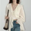S4e1cd85b98df49daa4059054df4f09e2c.webp CHIC VEN Women Shirt Loose Casual Ruffled Edges Female Blouses V Neck Lace Up Mid Length Woman Shirts Spring Summer 2026