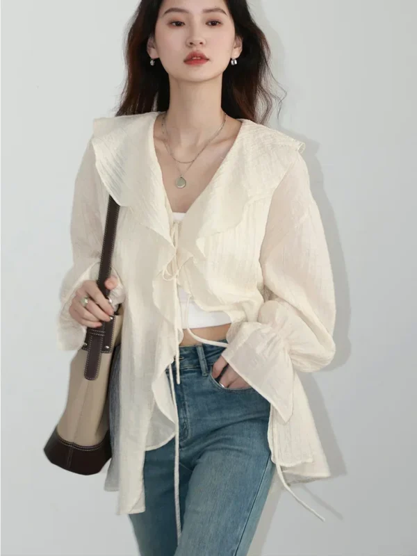 S4e1cd85b98df49daa4059054df4f09e2c.webp CHIC VEN Women Shirt Loose Casual Ruffled Edges Female Blouses V Neck Lace Up Mid Length Woman Shirts Spring Summer 2026